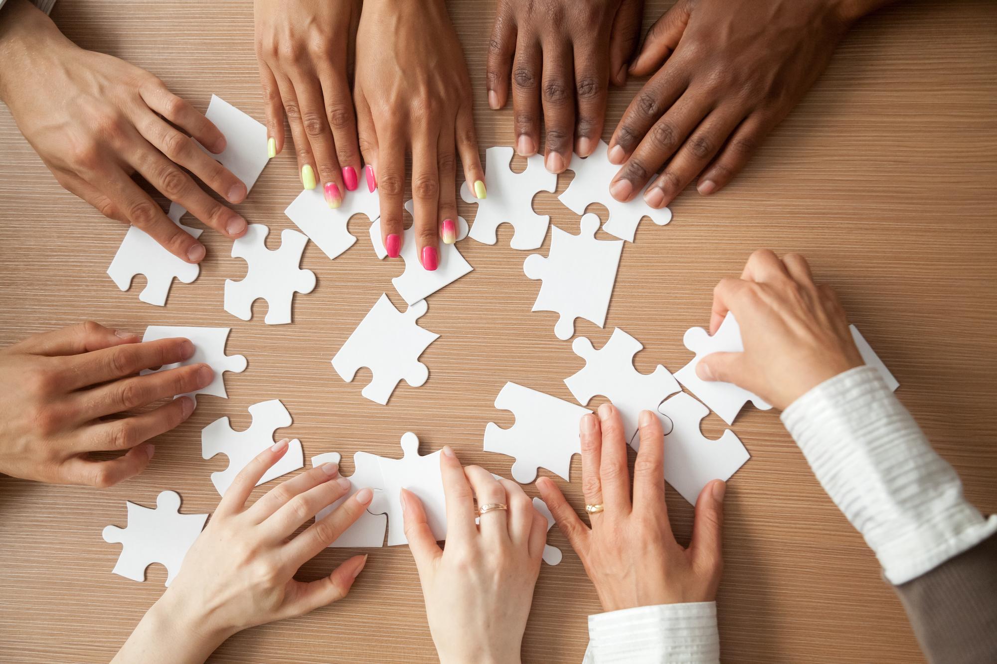 people doing a puzzle