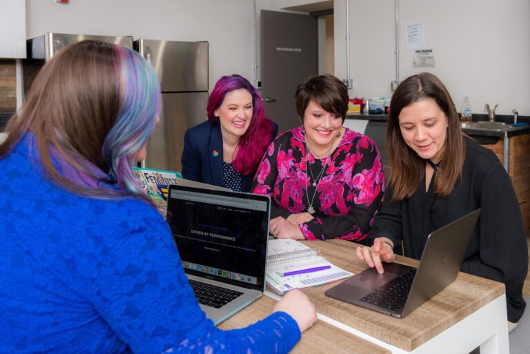 Women working and looking at a laptop