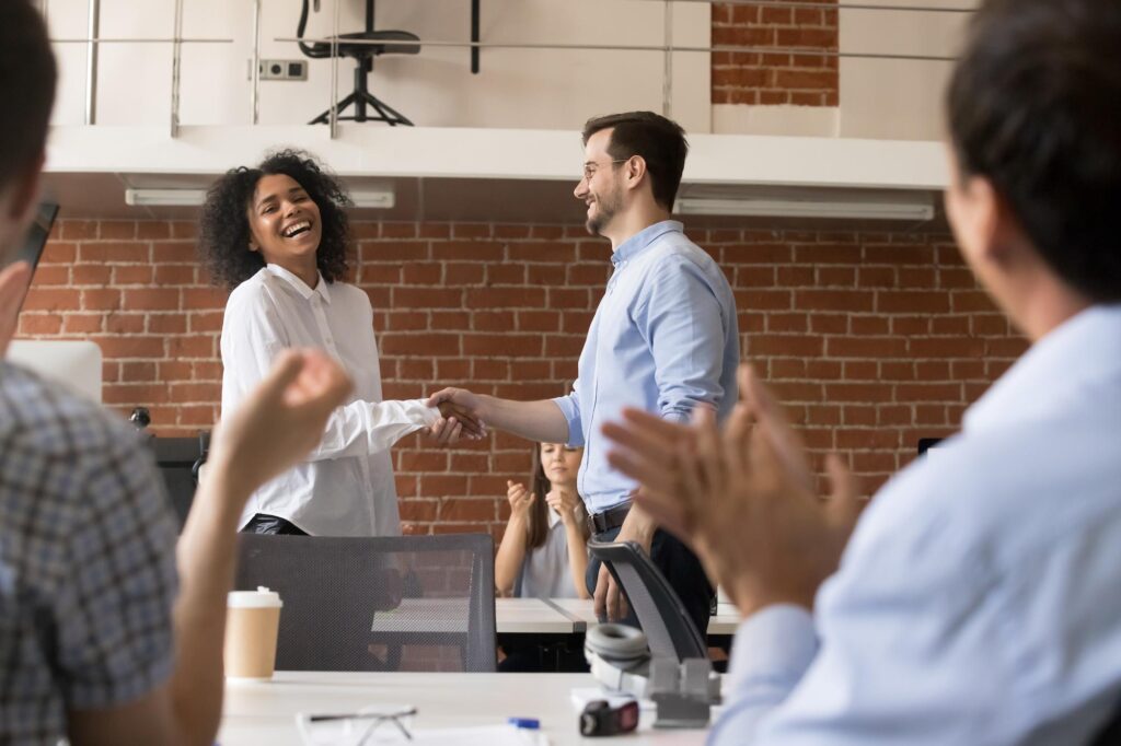 Woman and man shaking hands