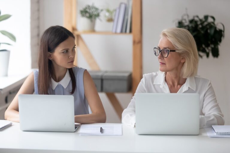 Woman mentoring a younger employee