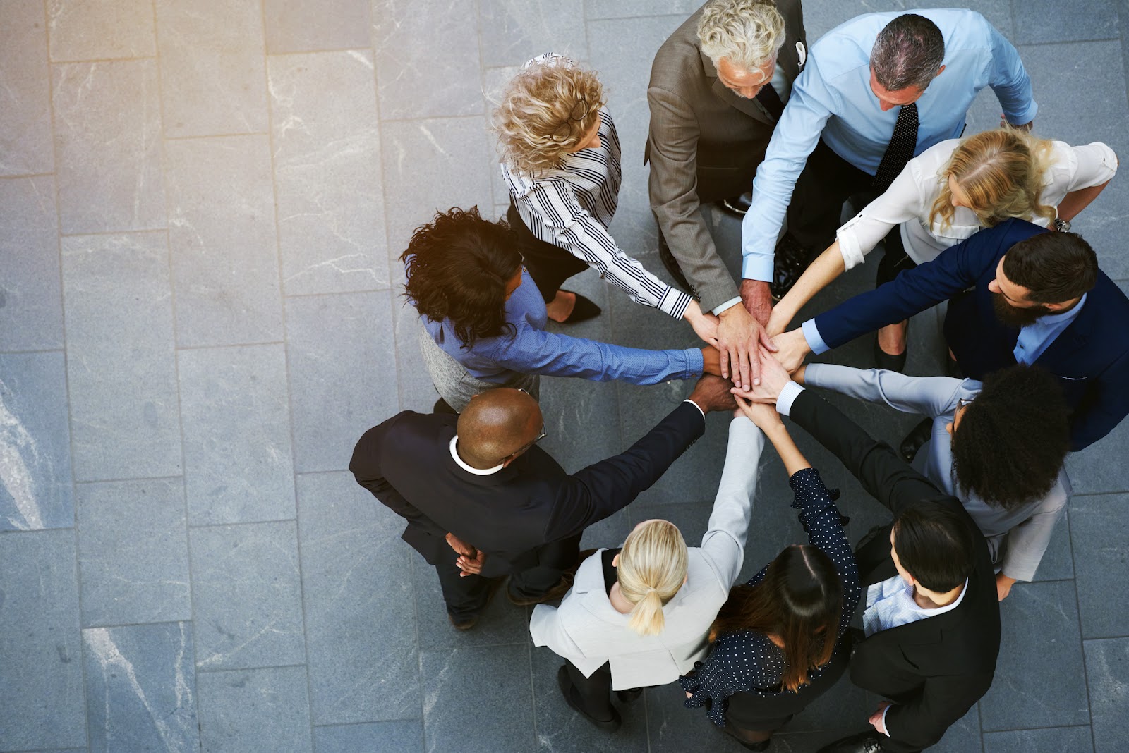 Diverse team with their hands together