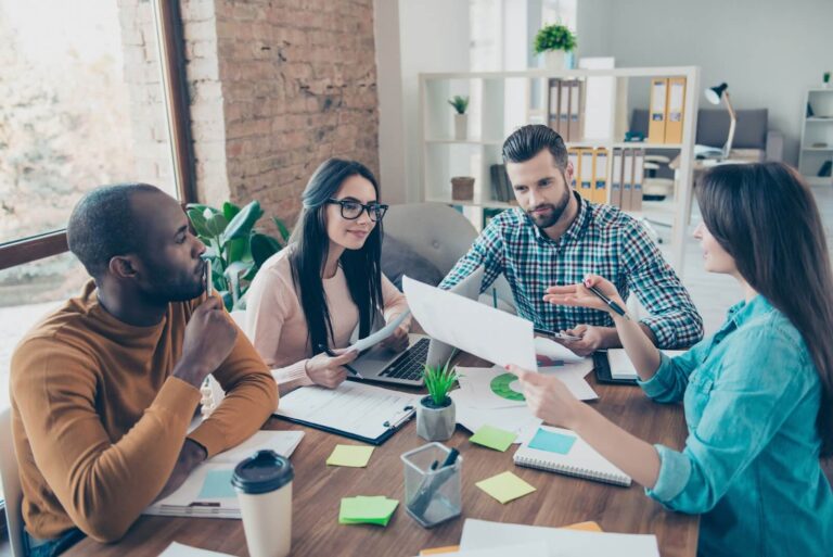 Man receiving feedback from peers